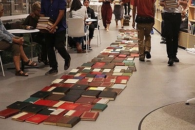 Laying a pathway of books.